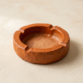 AI concept of a terracotta orange oval ashtray